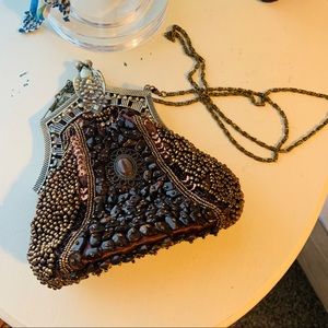 Brown beaded clutch